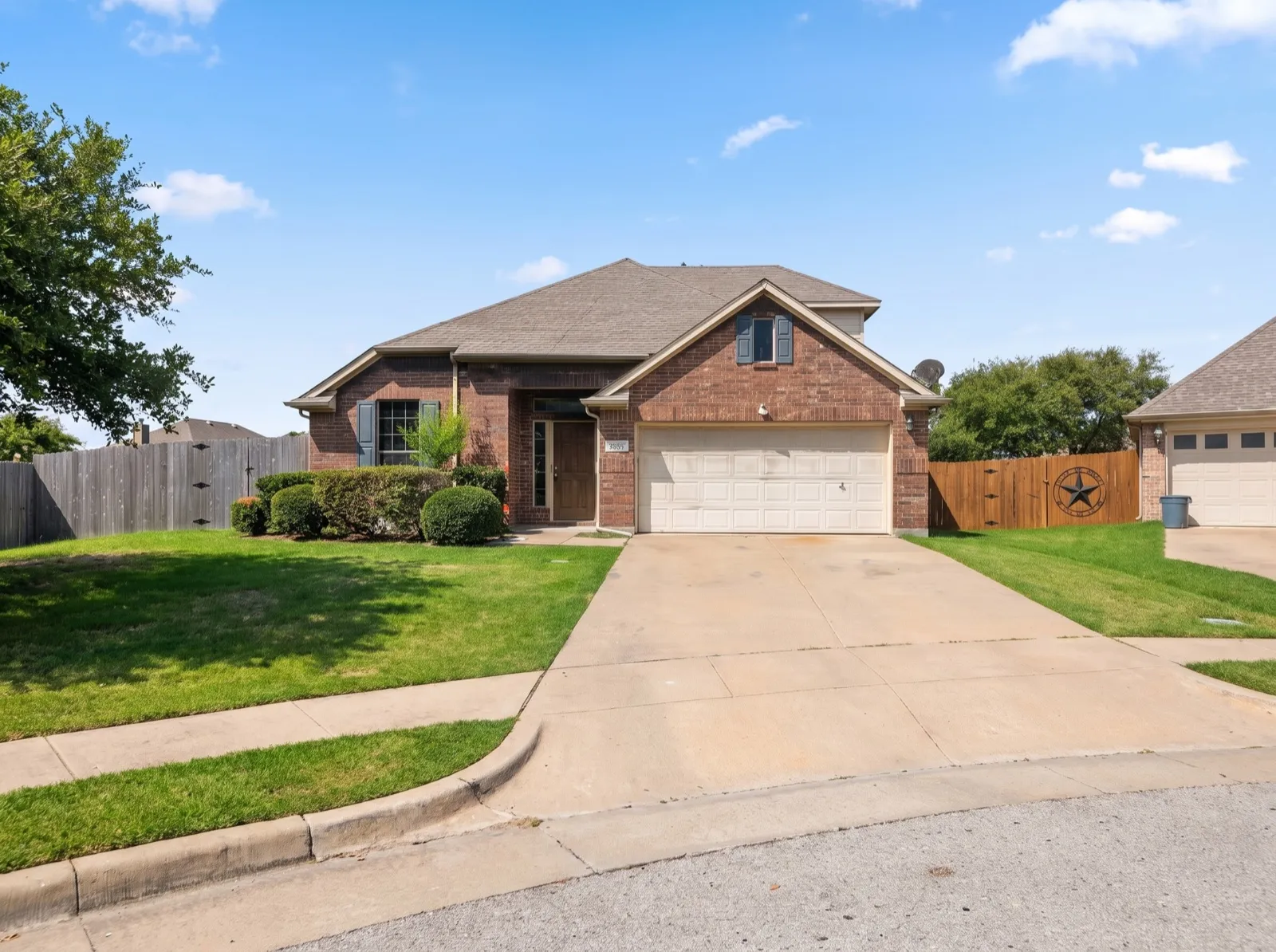Brick single-family home with a two-car garage in a Dallas–Fort Worth neighborhood